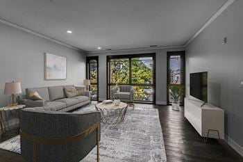 Contemporary living room with floor to ceiling windows